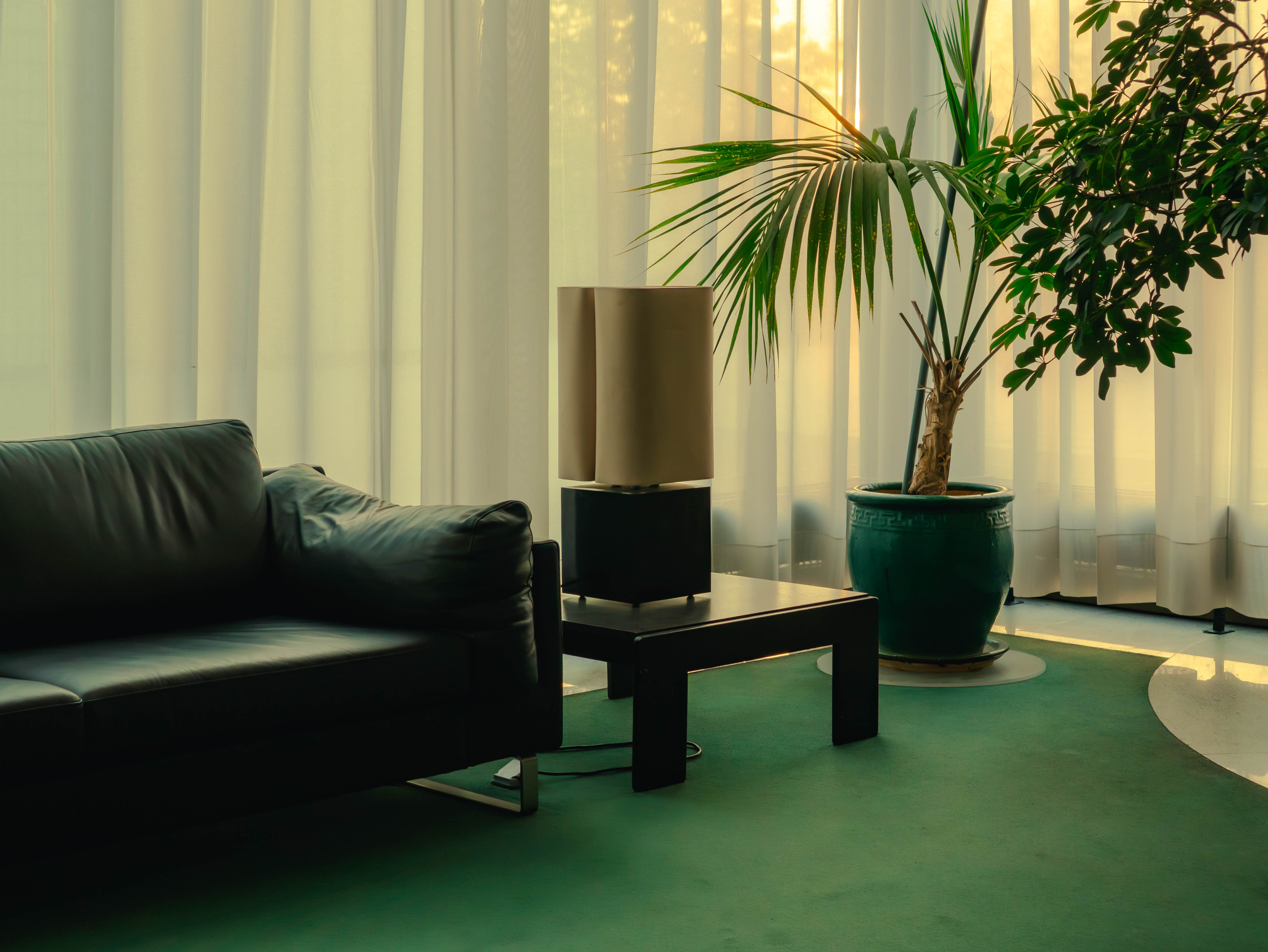 Interior space photographed to reveal design potential, featuring modern furniture in a well-lit room, conveying a sense of transformation and elegance